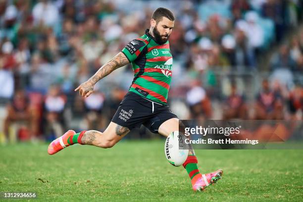 Adam Reynolds of the Rabbitohs attempts to kick a field goal during the round six NRL match between the South Sydney Rabbitohs and the Wests Tigers...