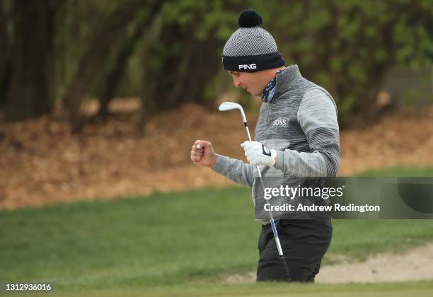 Matthias Schwab of Austria celebrates after holing his third shot from a bunker on the 9th hole during Day Three of the Austrian Golf Open at Diamond...