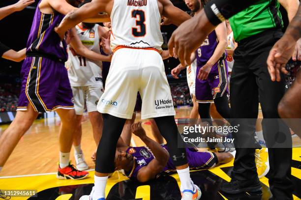Scott Machado of Cairns Taipans and Jordan Hunter of Sydney Kings shove each other, as the referees intervene after Casper Ware of Sydney Kings is...