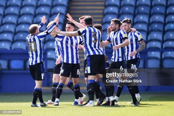 Julian Borner of Sheffield Wednesday celebrates with teammates after scoring their team's first goal during the Sky Bet Championship match between...