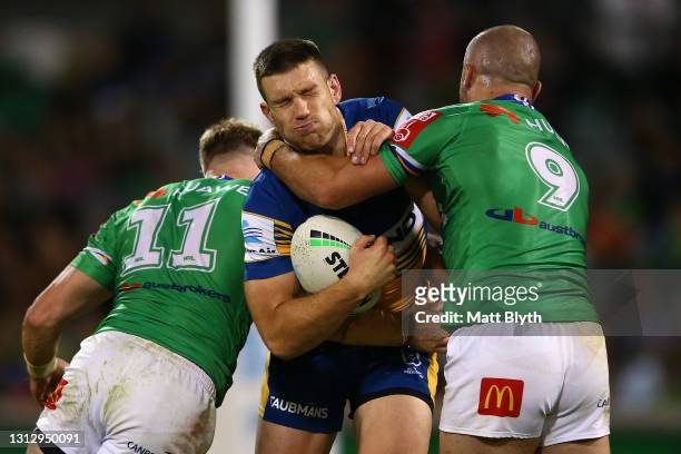 Tom Opacic of the Eels is tackled during the round six NRL match between the Canberra Raiders and the Parramatta Eels at GIO Stadium on April 17 in...