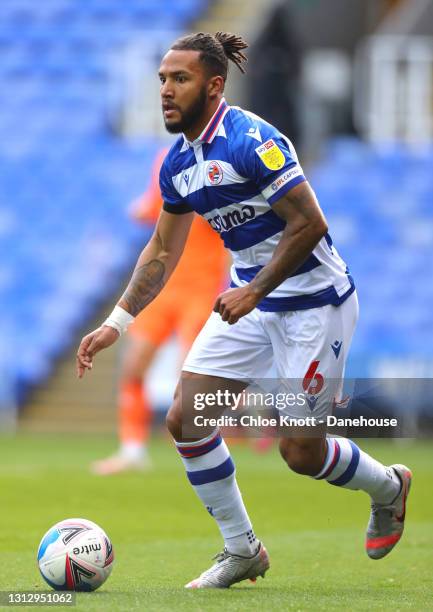 Liam Moore of Reading controls the ball during the Sky Bet Championship match between Reading and Cardiff City at Madejski Stadium on April 16, 2021...