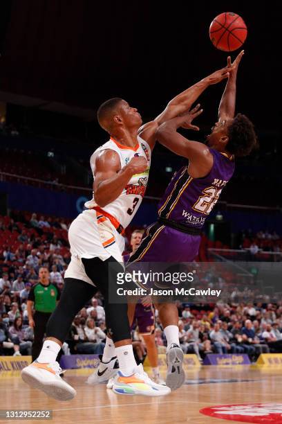 Casper Ware of the Kings shoots under pressure from Scott Machado of the Taipans during the round 14 NBL match between the Sydney Kings and the...