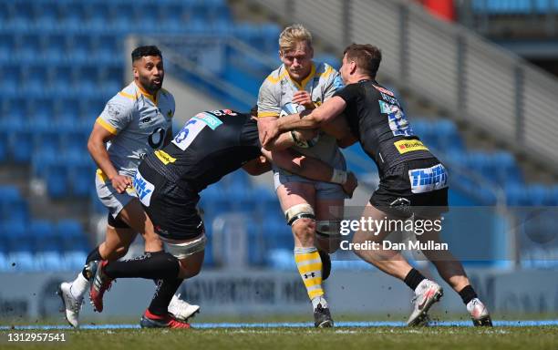 Ben Morris of Wasps is tackled by Dave Ewers and Ollie Devoto of Exeter Chiefs during the Gallagher Premiership Rugby match between Exeter Chiefs and...