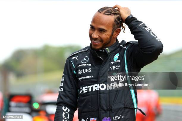 Pole position qualifier Lewis Hamilton of Great Britain and Mercedes GP looks on in parc ferme during qualifying ahead of the F1 Grand Prix of Emilia...