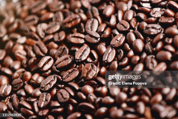 roasted coffee beans background - fair trade stock pictures, royalty-free photos & images