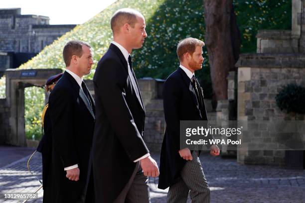 Peter Phillips, Prince William, Duke of Cambridge and Prince Harry, Duke of Sussex during the Ceremonial Procession during the funeral of Prince...