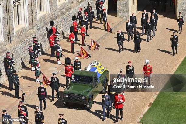 The Duke of Edinburgh’s coffin, covered with His Royal Highness’s Personal Standard is seen on the purpose built Land Rover, followed by Princess...