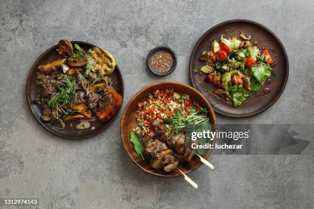 skirt steak. turkey skewers and bulgur salad - argentina food imagens e fotografias de stock