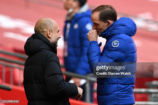 Pep Guardiola, Manager of Manchester City and Thomas Tuchel, Manager of Chelsea speak prior to the Semi Final of the Emirates FA Cup match between...