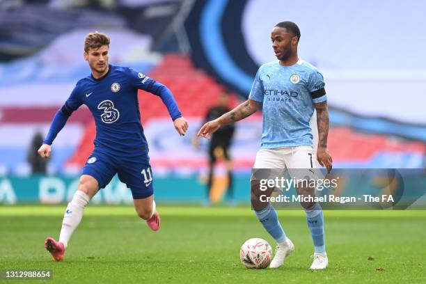 Raheem Sterling of Manchester City runs with the ball under pressure from Timo Werner of Chelsea during the Semi Final of the Emirates FA Cup match...