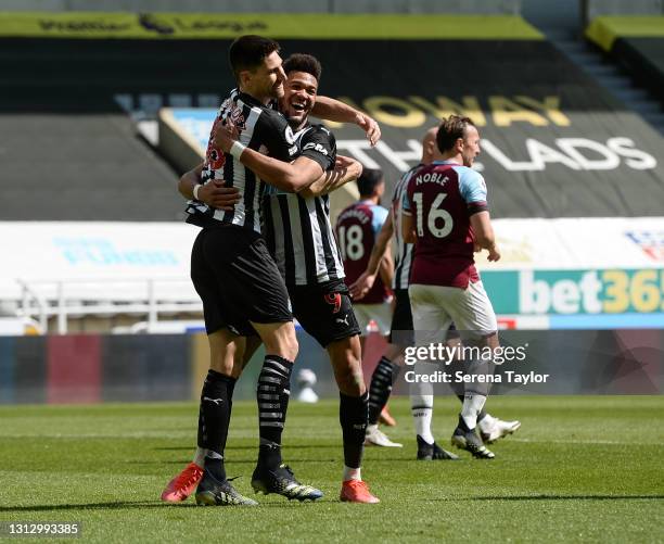 Joelinton of Newcastle United FC celebrates with teammate Federico Fernández after he scores the second goal during the Premier League match between...