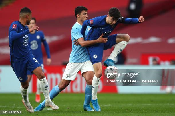 Kai Havertz of Chelsea is challenged by Rodrigo of Manchester City during the Semi Final of the Emirates FA Cup match between Manchester City and...