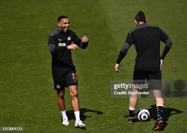 Newcastle striker Callum Wilson shares a joke with Andy Carroll during the warm up before the Premier League match between Newcastle United and West...