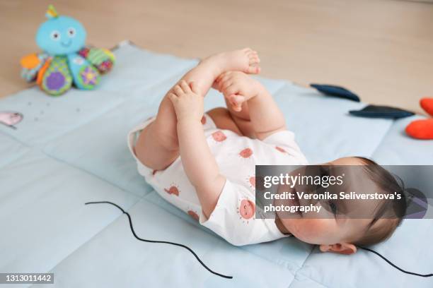 428 Baby Grabbing Feet Stock Photos High Res Pictures And Images 428-baby-grabbing-feet-stock-photos-high-res-pictures-and-images