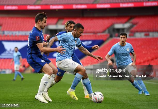 Gabriel Jesus of Manchester City holds off a challenge from Cesar Azpilicueta and Reece James of Chelsea during the Emirates FA Cup Semi Final match...