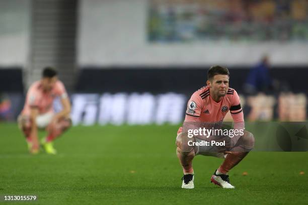 Oliver Norwood of Sheffield United is dejected after defeat confirmed their relegation from Premier League following the Premier League match between...