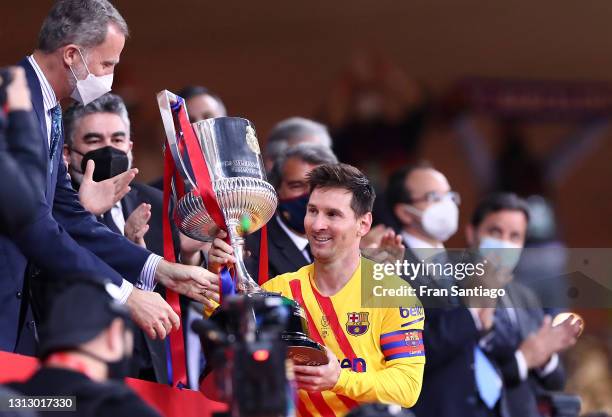 Lionel Messi of FC Barcelona lifts the trophy after winning the Copa Del Rey Final match between Athletic Club and Barcelona at Estadio de La Cartuja...