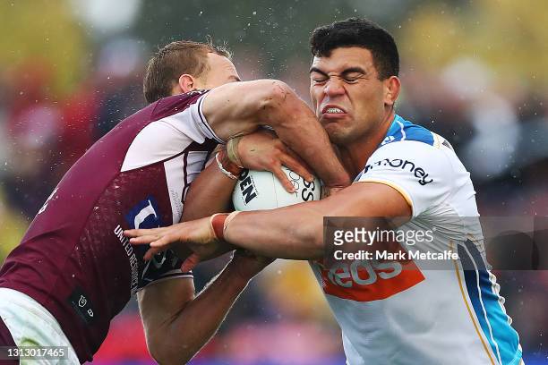 David Fifita of the Titans is tackled by Daly Cherry-Evans of the Sea Eagles during the round six NRL match between the Manly Sea Eagles and the Gold...