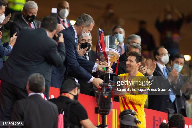 Felipe VI, King of Spain, give the trophy of Champions of the tournament to Lionel Messi of FC Barcelona after the spanish cup, Copa del Rey,...