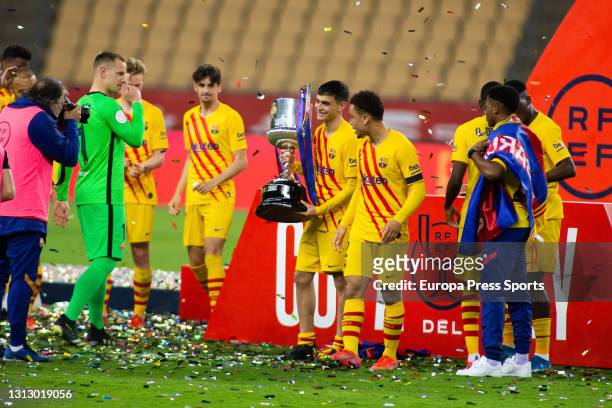 Pedro "Pedri" Gonzalez of FC Barcelona poses for photo with the trophy of champions of the tournament during the spanish cup, Copa del Rey, football...
