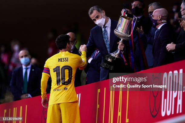 Lionel Messi of FC Barcelona salutes King Felipe VI after winning the Copa del Rey Final match between Athletic Club and Barcelona at Estadio de La...