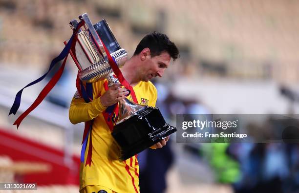 Lionel Messi of FC Barcelona holds the trophy after winning the Copa del Rey Final match between Athletic Club and Barcelona at Estadio de La Cartuja...