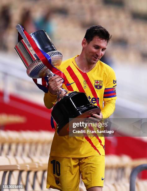 Lionel Messi of FC Barcelona holds the trophy after winning the Copa del Rey Final match between Athletic Club and Barcelona at Estadio de La Cartuja...