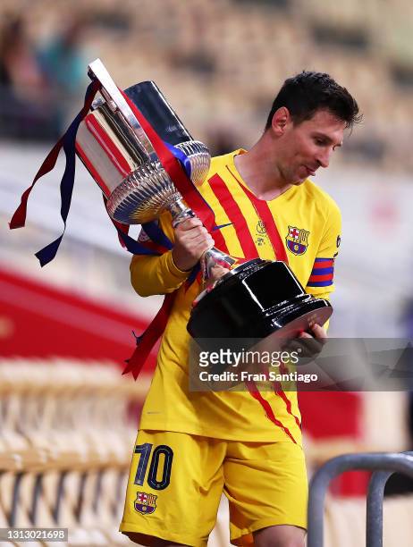Lionel Messi of FC Barcelona holds the trophy after winning the Copa del Rey Final match between Athletic Club and Barcelona at Estadio de La Cartuja...