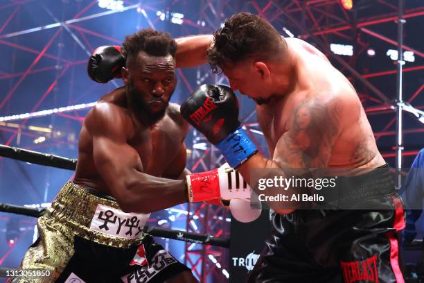 Steve Cunningham and Frank Mir trade punches in their heavyweight bout during Triller Fight Club at Mercedes-Benz Stadium on April 17, 2021 in...