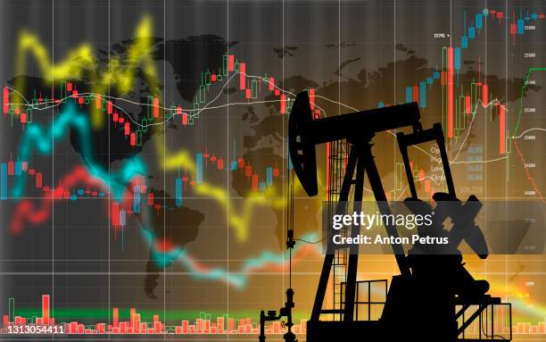 oil pump on the background of stock charts. changes in world oil prices - gas prices stock-fotos und bilder