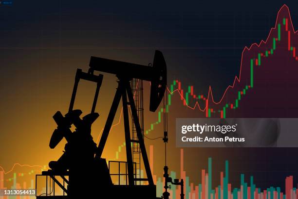 oil pump on the background of stock charts. changes in world oil prices - oil prices stock pictures, royalty-free photos & images