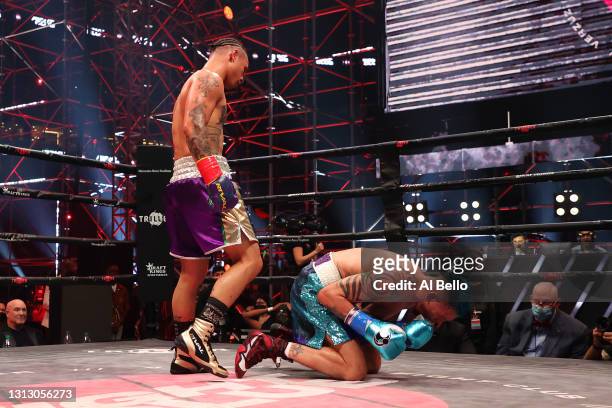 Ivan Redkach reacts after a blow in his junior welterweight bout against Regis Prograis during Triller Fight Club at Mercedes-Benz Stadium on April...
