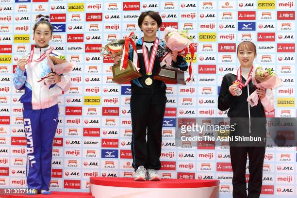Second place Hitomi Hatakeda, winner Mai Murakami and third place Yuna Hiraiwa pose on the podium at the medal ceremony for the Women's event on day...