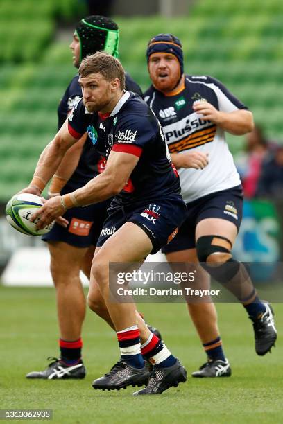 Lewis Holland of the Rebels passes the ball during the round nine Super RugbyAU match between the ACT Brumbies and the Melbourne Rebels at AAMI Park,...