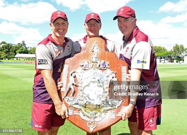 Queensland Coaches Andy Bichel and Wade Seccombe and team Physio Martin Love pose for a photo as they celebrate victory during day four of the...