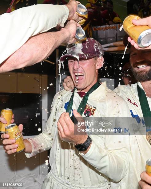 Marnus Labuschagne of Queensland celebrates victory with his team mates during day four of the Sheffield Shield Final match between Queensland and...