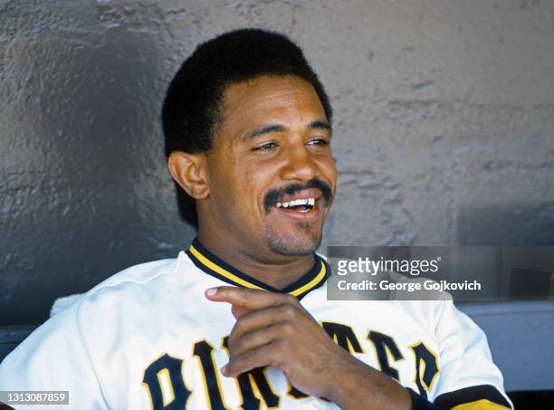 Catcher Tony Pena of the Pittsburgh Pirates smiles as he talks to reporters in the dugout before a Major League Baseball spring training exhibition...