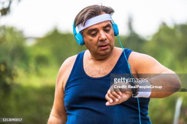 runner taking pulse - spy hunter stock pictures, royalty-free photos & images