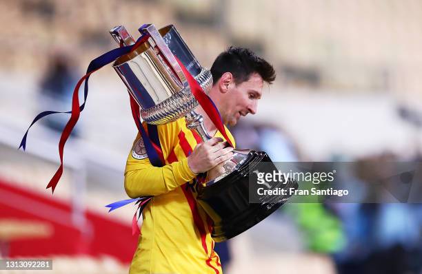 Lionel Messi of FC Barcelona holds the trophy after winning the Copa del Rey Final match between Athletic Club and Barcelona at Estadio de La Cartuja...
