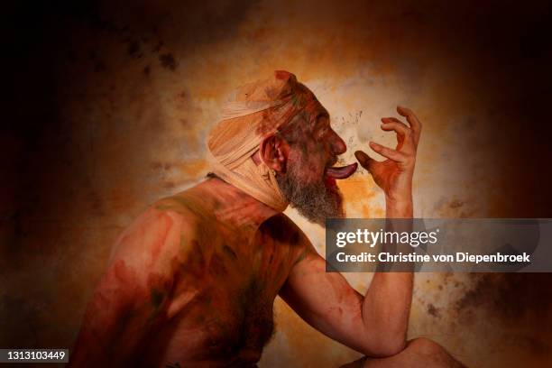 a devil licking his hand - theatre germany actor stock pictures, royalty-free photos & images