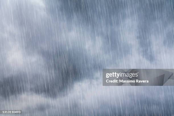 stormy clouds and torrential rain - chuva imagens e fotografias de stock