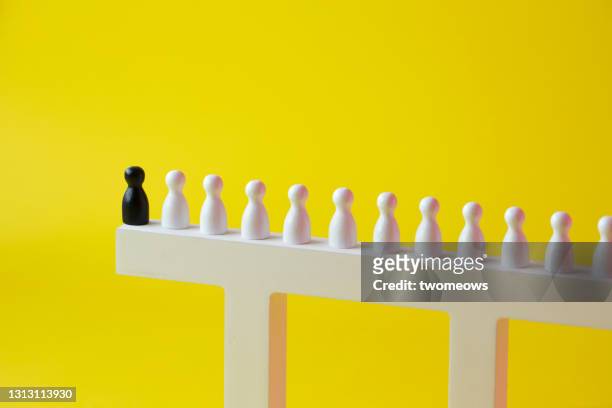 bad leadership concept abstract wooden figurines still life. - leading edge stock pictures, royalty-free photos & images