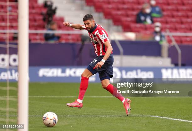 Yannick Ferreira Carrasco of Atletico Madrid scores their team's third goal during the La Liga Santander match between Atletico de Madrid and SD...