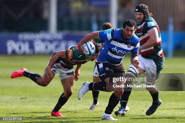 Josh Matavesi of Bath cuts between Matias Moroni and Harry Wells of Leicester makes the tackle during the Gallagher Premiership Rugby match between...