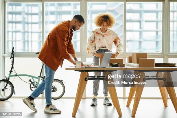 male and female freelancers working at home office - freelance work candid stock pictures, royalty-free photos & images