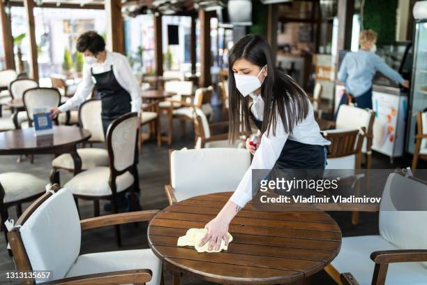 restaurant employees preparing for the reopening of the restaurant after coronavirus pandemic - bar code imagens e fotografias de stock
