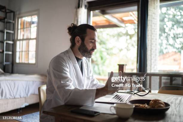 doctor on a telemedicine appointment at home - virtual visit stock pictures, royalty-free photos & images