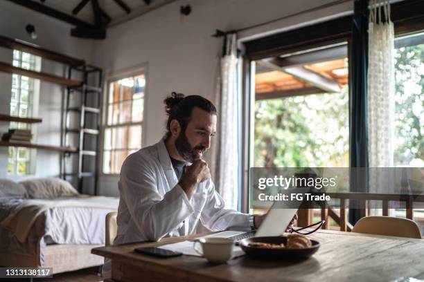 doctor on a telemedicine appointment at home - virtual visit stock pictures, royalty-free photos & images