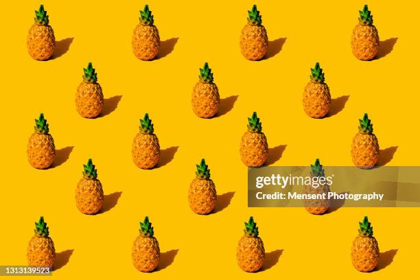 pineapple fruit pop art pattern on a yellow background - パイナップル ストックフォトと画像